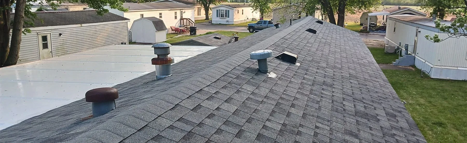 Dark grey roof shingles on a Midwest neighborhood home.
